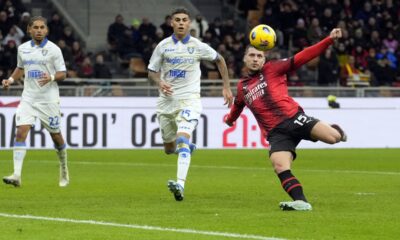 AC Milan's Luka Jovic, right, scores the opening goal during the Serie A soccer match between AC Milan and Frosinone at the San Siro stadium, in Milan, Italy, Friday, Dec. 2, 2023. (AP Photo/Luca Bruno)