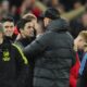 Liverpool's manager Jurgen Klopp, right, hugs Arsenal's manager Mikel Arteta at the end of the English Premier League soccer match between Liverpool and Arsenal at Anfield stadium in Liverpool, England, Saturday, Dec. 23, 2023. (AP Photo/Jon Super)