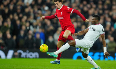 West Ham's Mohammed Kudus, right, and Liverpool's Curtis Jones battle for the ball during the English League Cup quarterfinal soccer match between Liverpool and West Ham United at the Anfield stadium in Liverpool, England, Wednesday, Dec. 20, 2023. (AP Photo/Jon Super)