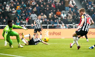 Newcastle United's Anthony Gordon, right, scores a goal during the English Premier League soccer match between Newcastle United and Manchester United at St. James' Park, Newcastle, England, Saturday, Dec. 2, 2023. (Owen Humphreys/PA via AP)