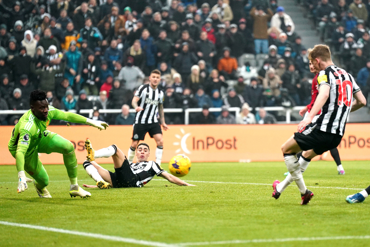 Newcastle United's Anthony Gordon, right, scores a goal during the English Premier League soccer match between Newcastle United and Manchester United at St. James' Park, Newcastle, England, Saturday, Dec. 2, 2023. (Owen Humphreys/PA via AP)