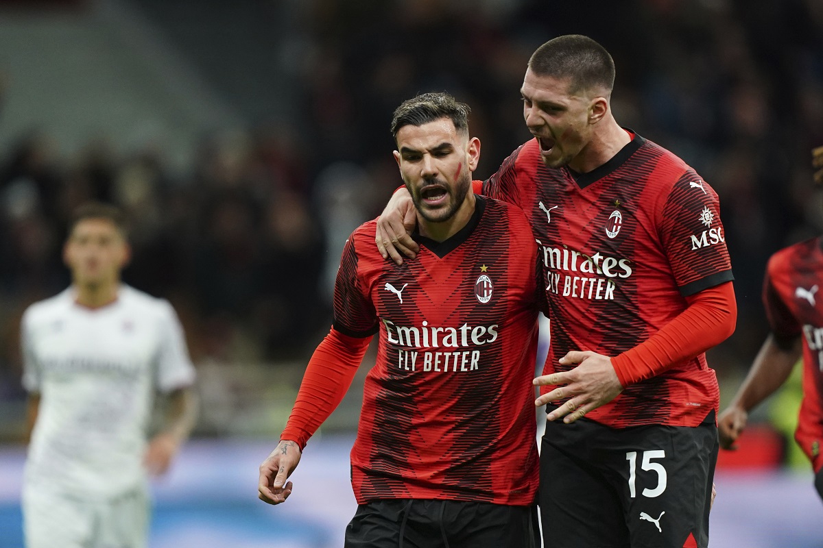 AC Milan's Theo Hernandez, left, celebrates with teammate Luka Jović after scoring his side's opening goal during a Serie A soccer match between AC Milan and Fiorentina, in Milan's San Siro Stadium, Italy, Saturday, Nov. 25, 2023. (Spada/LaPresse via AP)