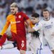 Copenhagen's Kevin Diks, center right, and Galatasaray's Mauro Icardi fight for the ball during the Champions League Group A soccer match between FC Copenhagen and Galatasaray, at the Parken Stadium, in Copenhagen, Tuesday, Dec. 12, 2023. (Liselotte Sabroe/Ritzau Scanpix via AP)