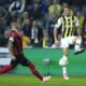 Fenerbahce's Dusan Tadic, right, plays the ball next to Spartak Trnava's Kristisn Kostrna during the Europa Conference League group H soccer match between Fenerbahce and Spartak Trnava at Sukru Saracoglu stadium in Istanbul, Turkey, Thursday, Dec. 14, 2023. (AP Photo/Francisco Seco)