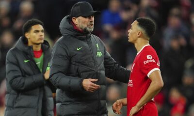 Liverpool's manager Jurgen Klopp, left, speaks with his player Trent Alexander-Arnold at the end of the English Premier League soccer match between Liverpool and Arsenal at Anfield stadium in Liverpool, England, Saturday, Dec. 23, 2023. (AP Photo/Jon Super)