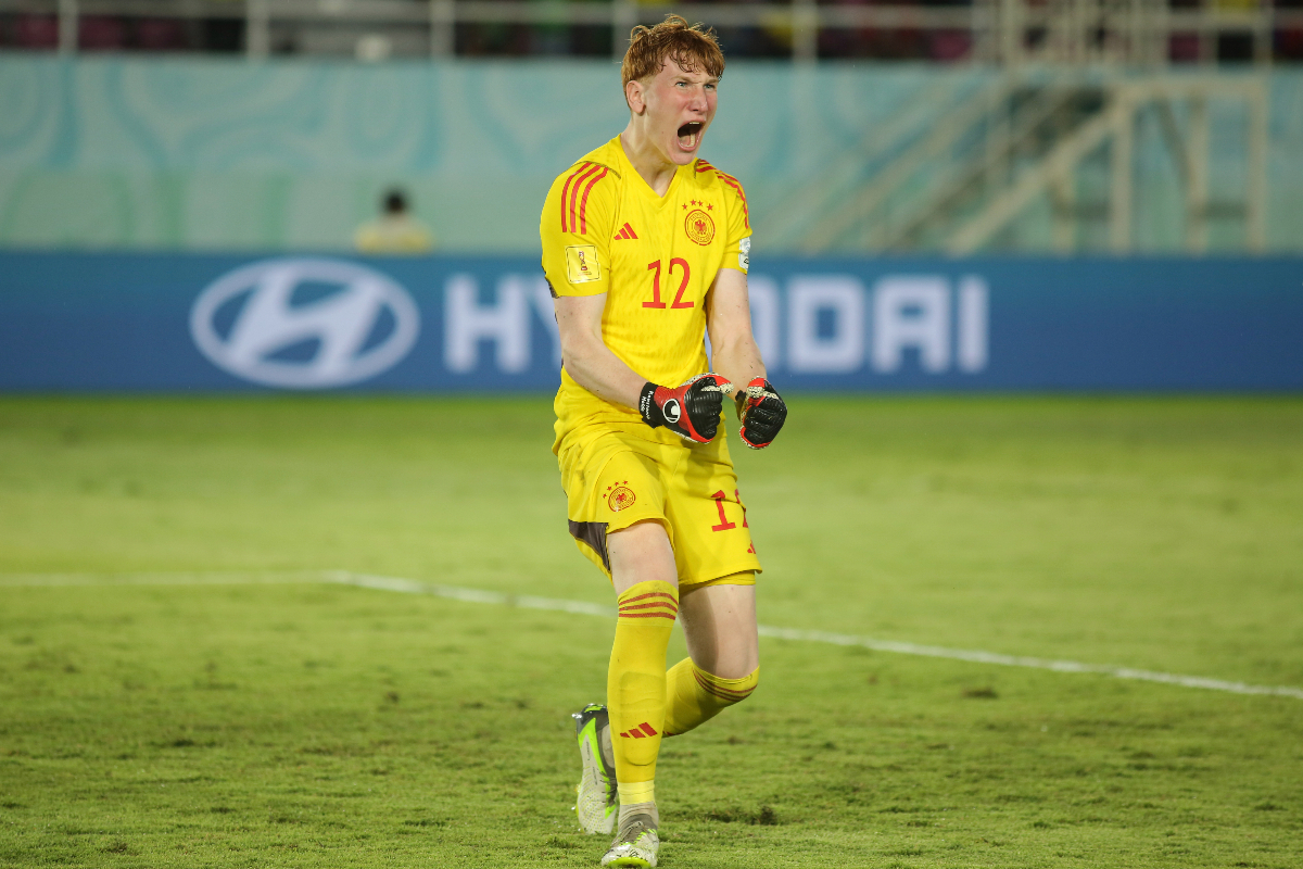 Germany's goalkeeper Konstantin Heide celebrates after making a safe during a penalty shootout against Argentina during their U-17 World Cup semifinal soccer match at Manahan Stadium in Surakarta, Central Java, Indonesia, Tuesday, Nov. 28, 2023. (AP Photo/John Sumbar)