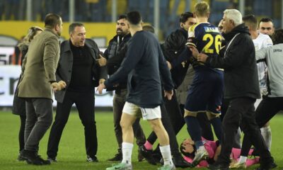 Referee Halil Umut Meler is seen lying on the ground, right, after being punched by MKE Ankaragucu president Faruk Koca, second from left, at the end of the Turkish Super Lig soccer match between MKE Ankaragucu and Caykur Rizespor in Ankara, Monday, Dec. 11, 2023. The Turkish Football Federation has suspended all league games in the country after a club president punched the referee in the face at the end of a top-flight match. Koca was arrested Tuesday, Dec. 12, 2023, along with two other people on charges of injuring a public official following questioning by prosecutors. (Abdurrahman Antakyali/Depo Photos via AP)