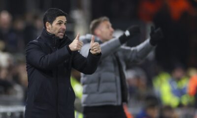 Arsenal's manager Mikel Arteta, left, and Luton Town's head coach Rob Edwards react during the English Premier League soccer match between Luton and Arsenal at Kenilworth Road, Luton, England, Tuesday, Dec. 5, 2023. (AP Photo/Ian Walton)