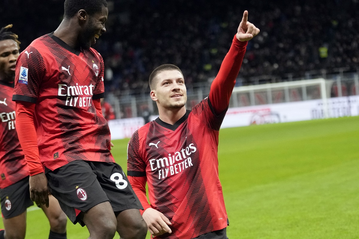 AC Milan's Luka Jovic, right, celebrates after scoring the opening goal during the Serie A soccer match between AC Milan and Frosinone at the San Siro stadium, in Milan, Italy, Friday, Dec. 2, 2023. (AP Photo/Luca Bruno)