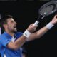 Serbia's Novak Djokovic reacts during his first round match against Croatia's Dino Prizmic at the Australian Open tennis championships at Melbourne Park, Melbourne, Australia, Sunday, Jan. 14, 2024. (AP Photo/Andy Wong)