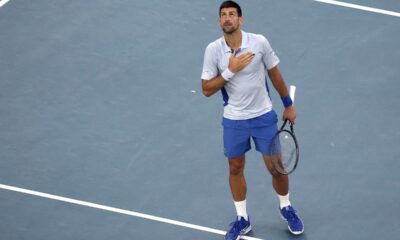 Novak Djokovic of Serbia reacts after defeating Taylor Fritz of the U.S. in their quarterfinal match at the Australian Open tennis championships at Melbourne Park, Melbourne, Australia, Tuesday, Jan. 23, 2024. (AP Photo/Alessandra Tarantino)