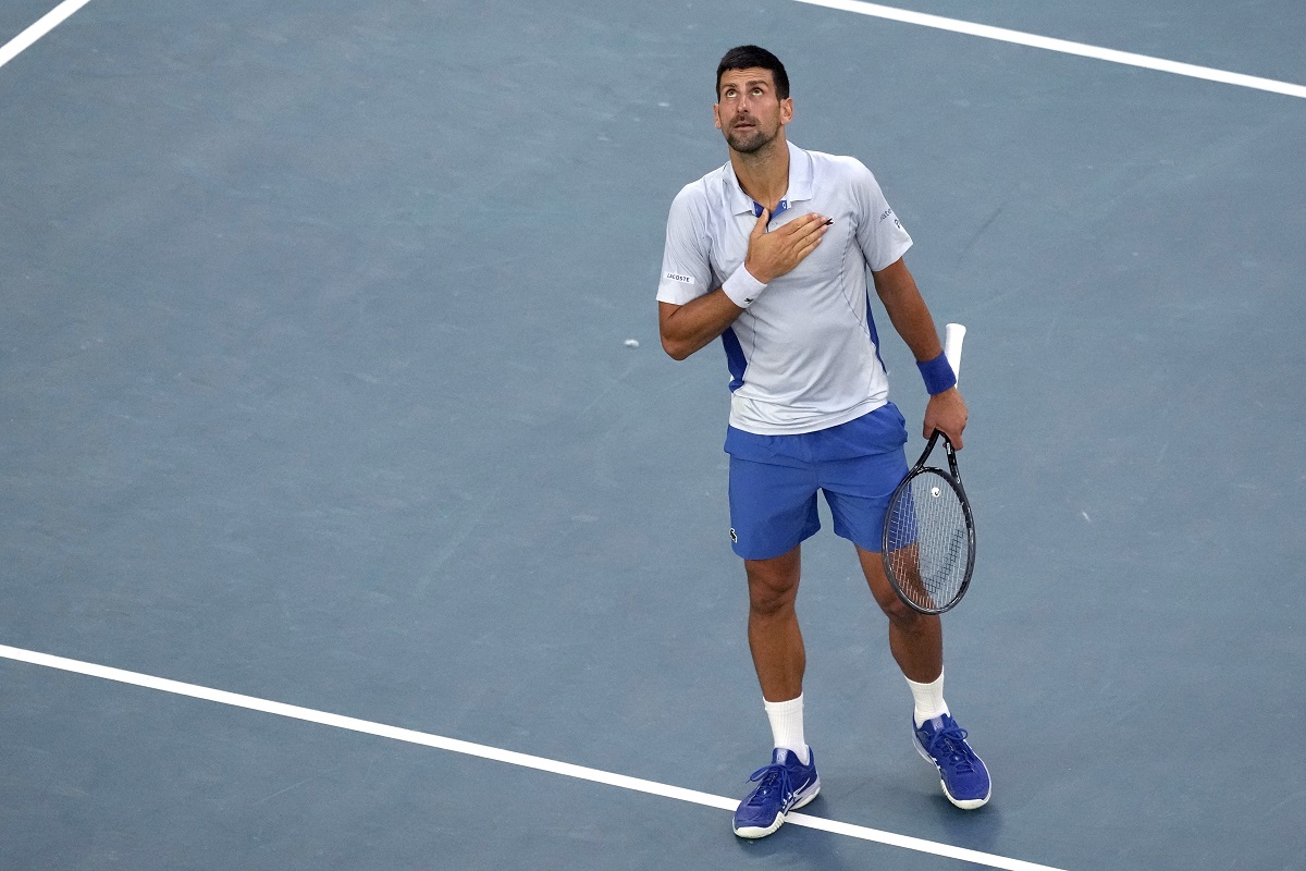 Novak Djokovic of Serbia reacts after defeating Taylor Fritz of the U.S. in their quarterfinal match at the Australian Open tennis championships at Melbourne Park, Melbourne, Australia, Tuesday, Jan. 23, 2024. (AP Photo/Alessandra Tarantino)