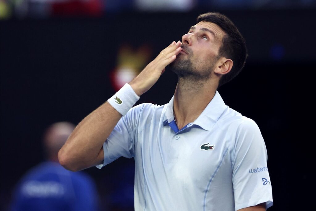 Novak Djokovic of Serbia celebrates after defeating Taylor Fritz of the U.S. in their quarterfinal match at the Australian Open tennis championships at Melbourne Park, Melbourne, Australia, Tuesday, Jan. 23, 2024. (AP Photo/Asanka Brendon Ratnayake)