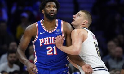 Philadelphia 76ers' Joel Embiid, elft, and Denver Nuggets' Nikola Jokic struggle for position during the first half of an NBA basketball game, Tuesday, Jan. 16, 2024, in Philadelphia. (AP Photo/Matt Slocum)