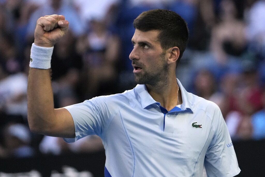 Novak Djokovic of Serbia reacts during his quarterfinal against Taylor Fritz of the U.S. at the Australian Open tennis championships at Melbourne Park, Melbourne, Australia, Tuesday, Jan. 23, 2024. (AP Photo/Andy Wong)
