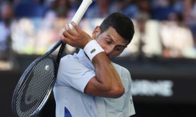 Novak Djokovic of Serbia wipes the sweat from his face during his quarterfinal against Taylor Fritz of the U.S. at the Australian Open tennis championships at Melbourne Park, Melbourne, Australia, Tuesday, Jan. 23, 2024. (AP Photo/Asanka Brendon Ratnayake)