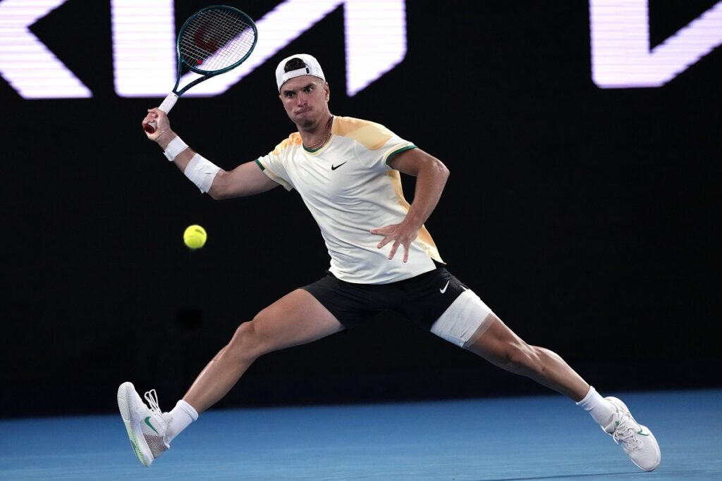 Croatia's Dino Prizmic plays a forehand return to Serbia's Novak Djokovic during their first round match at the Australian Open tennis championships at Melbourne Park, Melbourne, Australia, Sunday, Jan. 14, 2024. (AP Photo/Andy Wong)