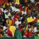 Guinea Supporters chant during the African Cup of Nations Group C soccer match between Cameroon and Guinea at the Charles Konan Banny stadium in Yamoussoukro, Ivory Coast, Monday, Jan. 15, 2024. (AP Photo/Sunday Alamba)