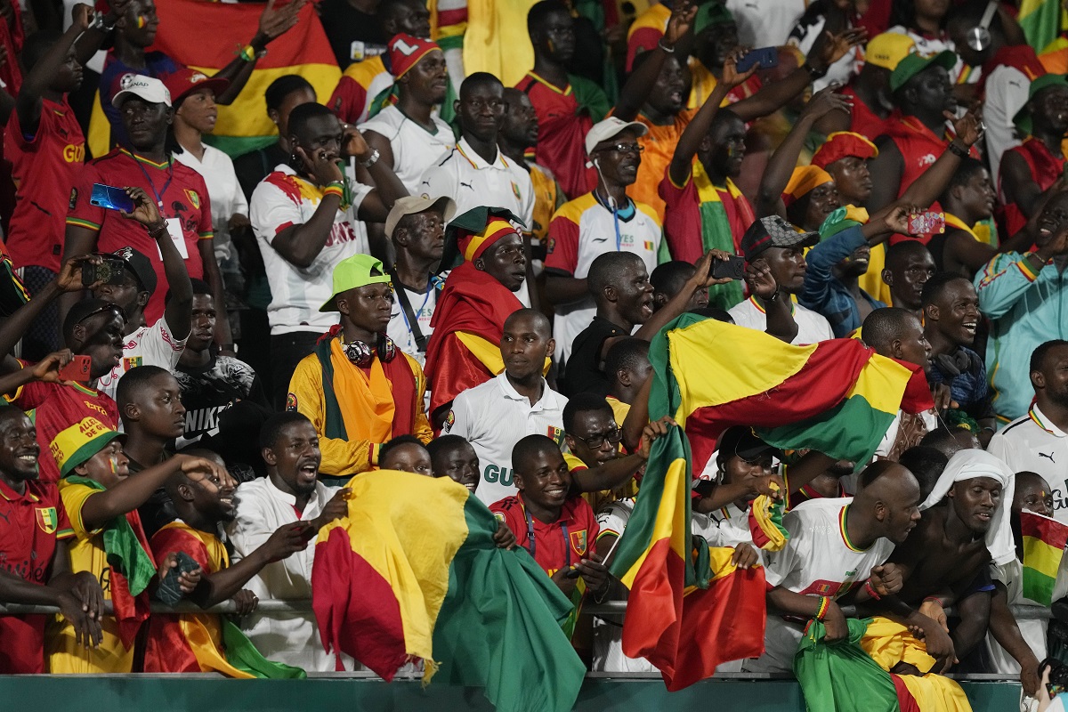 Guinea Supporters chant during the African Cup of Nations Group C soccer match between Cameroon and Guinea at the Charles Konan Banny stadium in Yamoussoukro, Ivory Coast, Monday, Jan. 15, 2024. (AP Photo/Sunday Alamba)