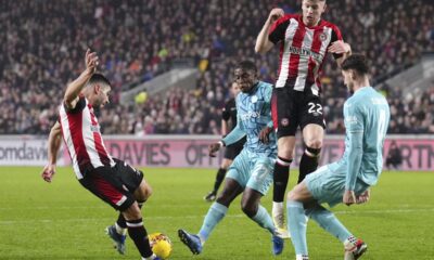 Brentford's Neal Maupay, left, scores his side's first goal of the game during the English FA Cup, third round soccer match between Brentford and Wolverhampton Wanderers, at the Gtech Community Stadium, in London, Friday, Jan. 5, 2024. (John Walton/PA via AP)
