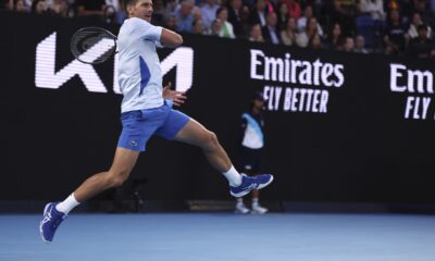 Novak Djokovic of Serbia plays a forehand return to Tomas Martin Etcheverry of Argentina during their third round match at the Australian Open tennis championships at Melbourne Park, Melbourne, Australia, Friday, Jan. 19, 2024. (AP Photo/Asanka Brendon Ratnayake)