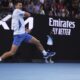 Novak Djokovic of Serbia plays a forehand return to Tomas Martin Etcheverry of Argentina during their third round match at the Australian Open tennis championships at Melbourne Park, Melbourne, Australia, Friday, Jan. 19, 2024. (AP Photo/Asanka Brendon Ratnayake)