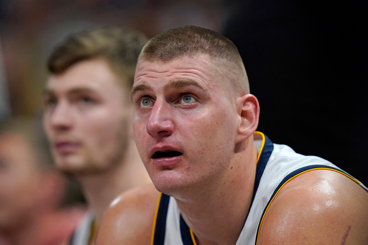 Denver Nuggets center Nikola Jokic looks sits on the bench during the second half of the team's NBA basketball game against the Utah Jazz on Wednesday, Jan. 10, 2024, in Salt Lake City. (AP Photo/Rick Bowmer)