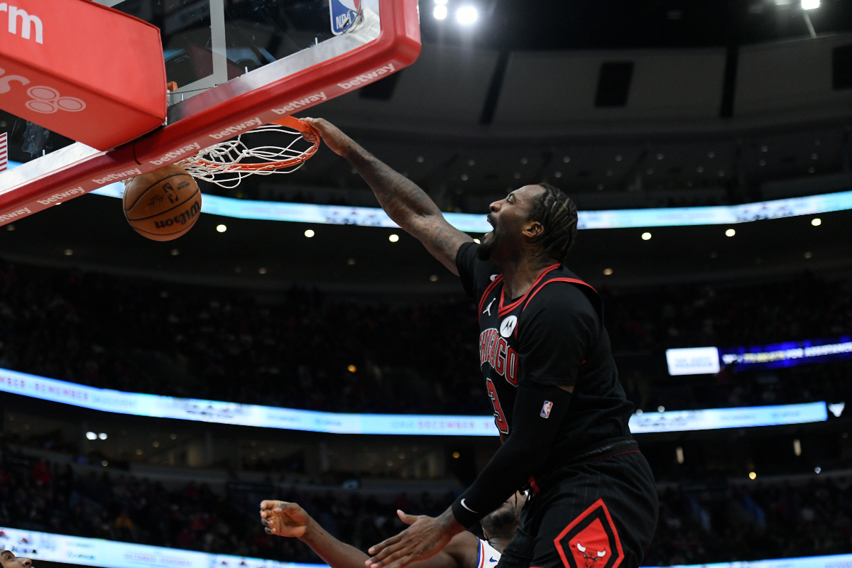 Chicago Bulls' Andre Drummond, top, dunks during the second half of an NBA basketball game against the Philadelphia 76ers, Saturday, Dec. 30, 2023, in Chicago. (AP Photo/Paul Beaty)