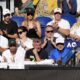 The support team for Novak Djokovic of Serbia watch his quarterfinal against Taylor Fritz of the U.S. at the Australian Open tennis championships at Melbourne Park, Melbourne, Australia, Tuesday, Jan. 23, 2024. (AP Photo/Andy Wong)