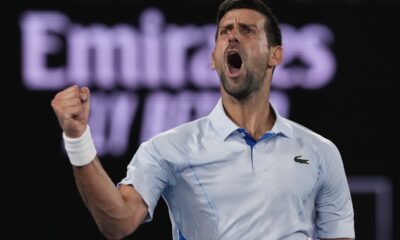 Serbia's Novak Djokovic celebrates after winning the third set against Croatia's Dino Prizmic during their first round match at the Australian Open tennis championships at Melbourne Park, Melbourne, Australia, Sunday, Jan. 14, 2024. (AP Photo/Andy Wong)