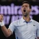 Serbia's Novak Djokovic celebrates after winning the third set against Croatia's Dino Prizmic during their first round match at the Australian Open tennis championships at Melbourne Park, Melbourne, Australia, Sunday, Jan. 14, 2024. (AP Photo/Andy Wong)