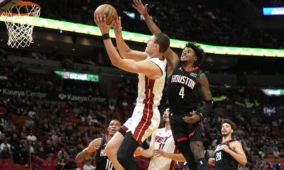 Miami Heat forward Nikola Jovic (5) drives to the basket as Houston Rockets guard Jalen Green (4) defends during the first half of an NBA basketball game, Monday, Jan. 8, 2024, in Miami. (AP Photo/Marta Lavandier)