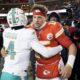 Miami Dolphins cornerback Kader Kohou (4) hugs Kansas City Chiefs quarterback Patrick Mahomes after an NFL wild-card playoff football game Saturday, Jan. 13, 2024, in Kansas City, Mo. (AP Photo/Charlie Riedel)