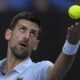 Novak Djokovic of Serbia serves to Taylor Fritz of the U.S. during their quarterfinal match at the Australian Open tennis championships at Melbourne Park, Melbourne, Australia, Tuesday, Jan. 23, 2024. (AP Photo/Louise Delmotte)