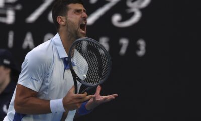 Novak Djokovic of Serbia reacts after losing a point to Taylor Fritz of the U.S. during their quarterfinal match at the Australian Open tennis championships at Melbourne Park, Melbourne, Australia, Tuesday, Jan. 23, 2024. (AP Photo/Asanka Brendon Ratnayake)