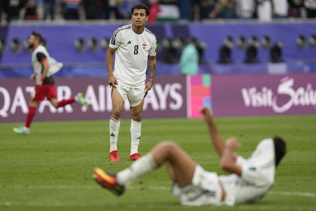 Iraq's Ibrahim Bayesh Al-Kaabawi is dejected at full time of the Asian Cup Round of 16 soccer match between Iraq and Jordan, at Khalifa International Stadium in Doha, Qatar, Monday, Jan. 29, 2024. Jordan won 3-2. (AP Photo/Thanassis Stavrakis)
