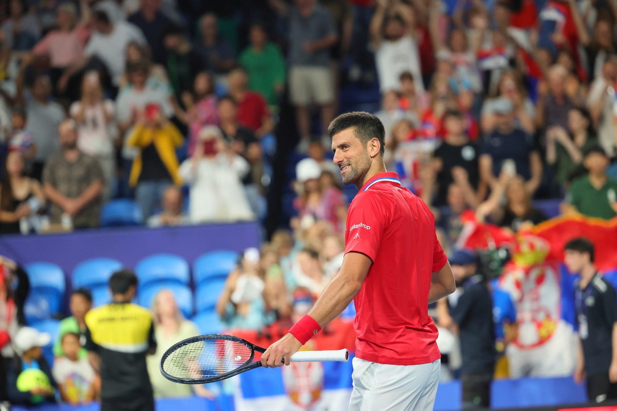 Novak Djokovic of Serbia celebrates his win over Zhizhen Zhang of China during the United Cup tennis tournament in Perth, Australia, Sunday, Dec. 31, 2023. (AP Photo/Trevor Collens)