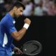 Serbia's Novak Djokovic reacts during his first round match against Croatia's Dino Prizmic at the Australian Open tennis championships at Melbourne Park, Melbourne, Australia, Sunday, Jan. 14, 2024. (AP Photo/Andy Wong)