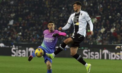 AC Milan's Christian Pulisic, left, and Uninese's Lazar Samardzic charge the ball during the Serie A soccer match between Udinese and Milan in Udine, Italy, Saturday, Jan. 20, 2024. (Andrea Bressanutti/LaPresse via AP)