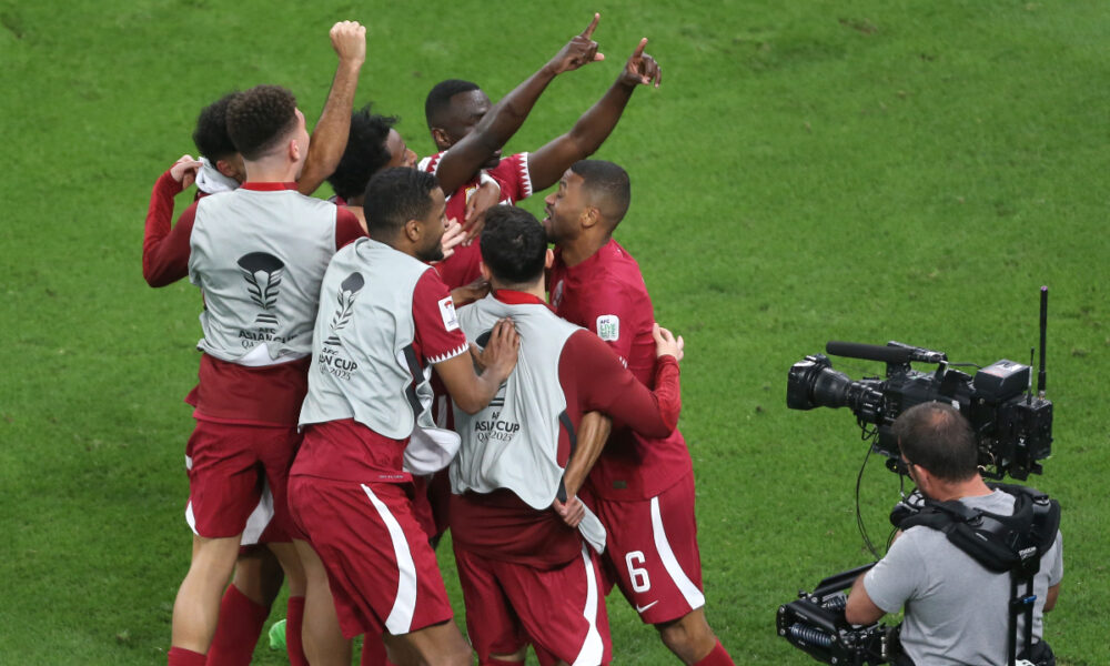 Qatar's Almoez Ali, centre, celebrates with teammates after scoring goal during the Asian Cup semifinal soccer match between Qatar and Iran at Al Thumama Stadium in Doha, Qatar, Wednesday, Feb. 7, 2024. (AP Photo/Hussein Sayed)