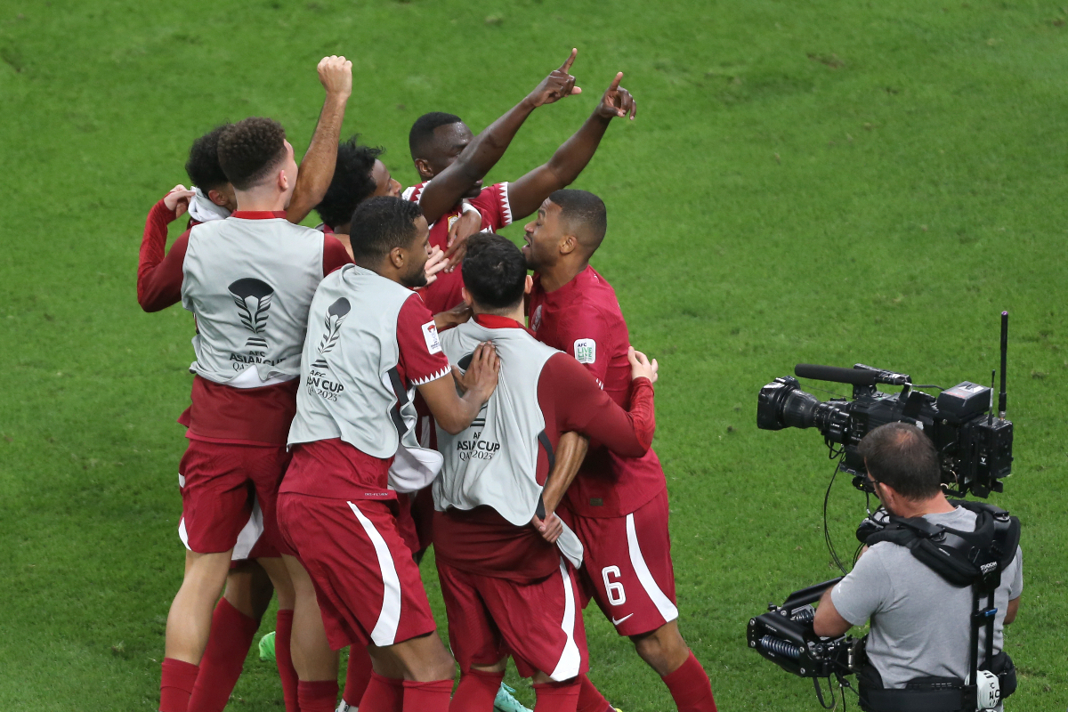 Qatar's Almoez Ali, centre, celebrates with teammates after scoring goal during the Asian Cup semifinal soccer match between Qatar and Iran at Al Thumama Stadium in Doha, Qatar, Wednesday, Feb. 7, 2024. (AP Photo/Hussein Sayed)