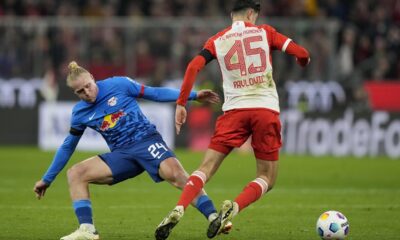 Leipzig's Xaver Schlager, left, and Bayern's Aleksandar Pavlovic challenge for the ball during the German Bundesliga soccer match between FC Bayern Munich and RB Leipzig at the Allianz Arena in Munich, Germany, Feb. 24, 2024. (AP Photo/Matthias Schrader)