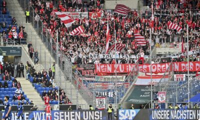 Berlin fans throw tennis balls on the pitch to protest the German soccer federation, during the German Bundesliga soccer match between TSG 1899 Hoffenheim and 1. FC Union Berlin at the PreZero Arena in Sinsheim, Germany, Saturday, Feb. 17, 2024. (Jan-Philipp Strobel/dpa via AP)