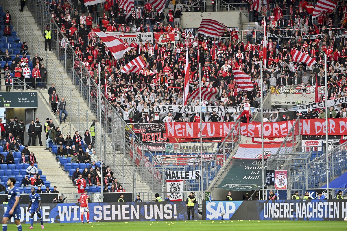 Berlin fans throw tennis balls on the pitch to protest the German soccer federation, during the German Bundesliga soccer match between TSG 1899 Hoffenheim and 1. FC Union Berlin at the PreZero Arena in Sinsheim, Germany, Saturday, Feb. 17, 2024. (Jan-Philipp Strobel/dpa via AP)