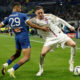 Lyon's Nemania Matic fights for the ball with Marseille's Iliman Ndiaye during a French League One soccer match between Lyon and Marseille at the Groupama stadium, outside Lyon, France, Sunday, Feb. 4, 2024. (AP Photo/Laurent Cipriani)