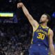 FILE - Golden State Warriors guard Stephen Curry (30) gestures during an NBA basketball game against the Oklahoma City Thunder in San Francisco, Saturday, Nov. 18, 2023. All-Star Saturday Night, Feb. 17, 2024, gets an event like never before: Sabrina Ionescu vs. Stephen Curry, in a 3-point battle of the sexes.(AP Photo/Jeff Chiu, File)