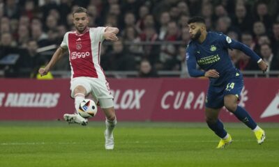 Ajax's Jordan Henderson, left, and PSV's Ismael Saibari, right, vie for the ball during the Dutch Eredivisie soccer match between Ajax and PSV at ArenA stadium Amsterdam, Netherlands, Saturday, Feb. 3, 2024. (AP Photo/Peter Dejong)