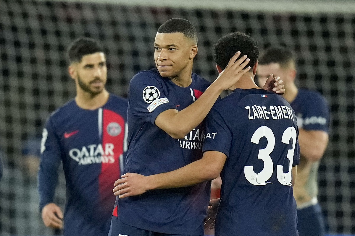 PSG's Kylian Mbappe, front left, celebrates with teammates at the end of the Champions League round of 16 first leg soccer match between Paris Saint-Germain and Real Sociedad, at the Parc des Princes stadium in Paris, France, Wednesday, Feb. 14, 2024. (AP Photo/Christophe Ena)