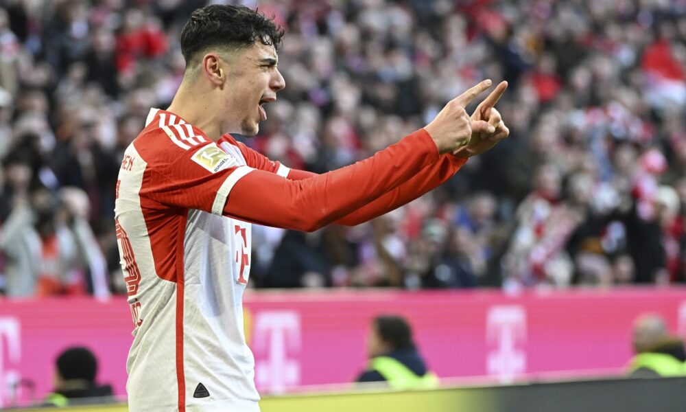 Bayern Munich's Aleksandar Pavlovic celebrates scoring his side's opening goal during the German Bundesliga soccer match between Bayern Munich and Borussia Moenchengladbach, at the Allianz Arena in Munich, Germany, Saturday, Feb. 3, 2024. (Angelika Warmuth/dpa via AP)