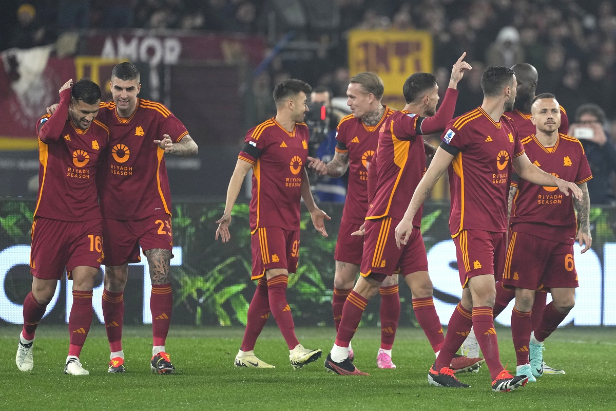 Roma's players celebrate a goal from they teammate Lorenzo Pellegrini, against Cagliari during a Serie A soccer match between Roma and Cagliari, at Rome's Olympic Stadium, on Monday, Feb. 5, 2024. (AP Photo/Andrew Medichini)